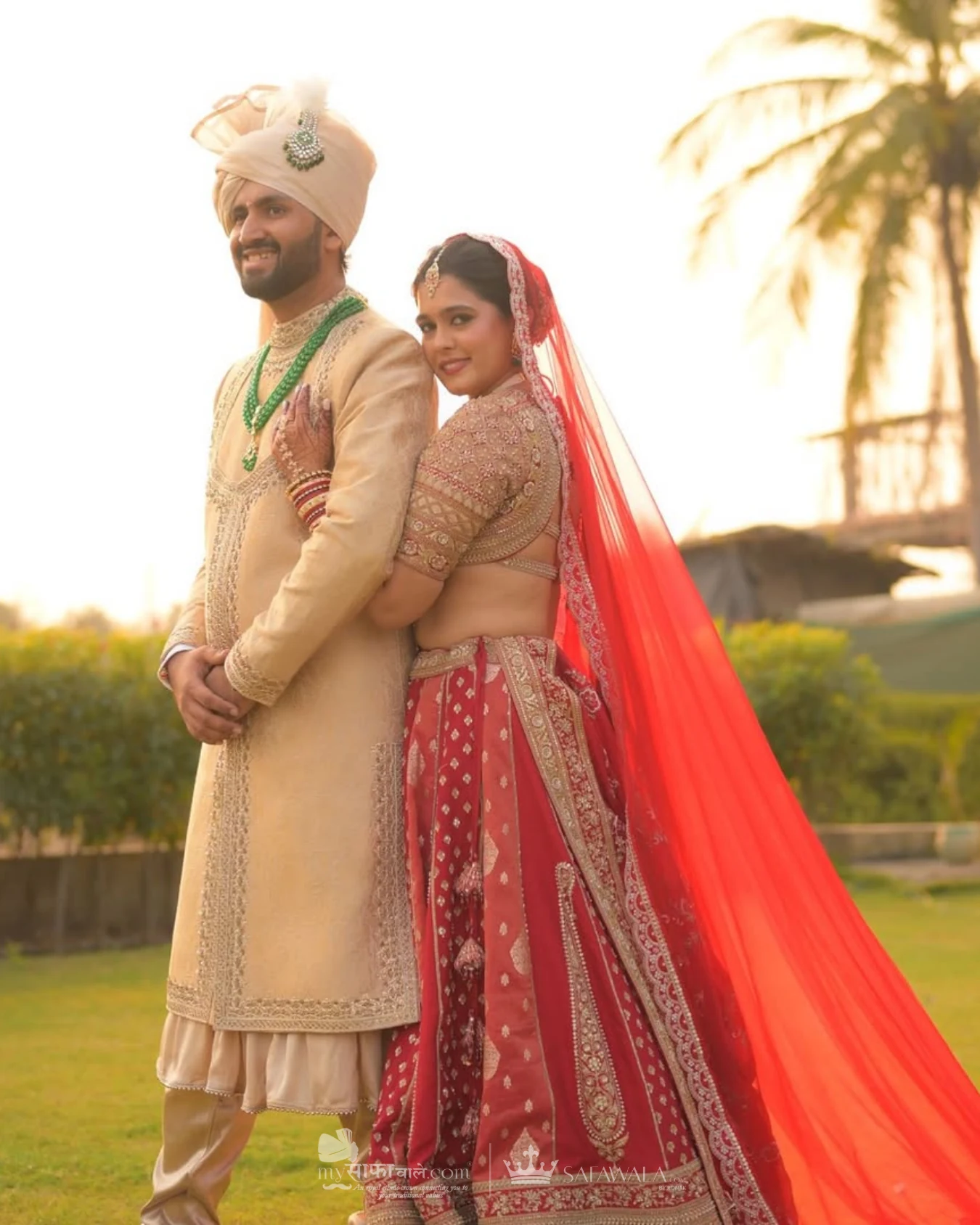 Classic groom pagdi styled with a red ceremonial stole for Raja Park